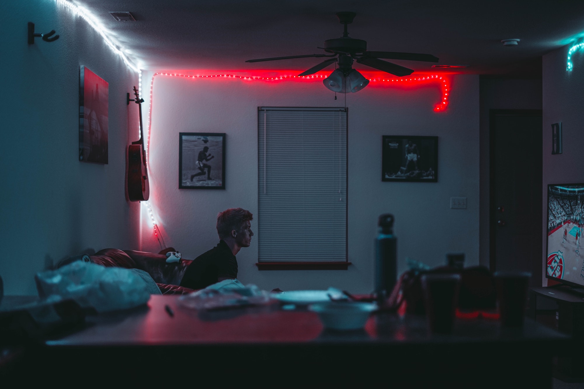 guy video gaming in dark room